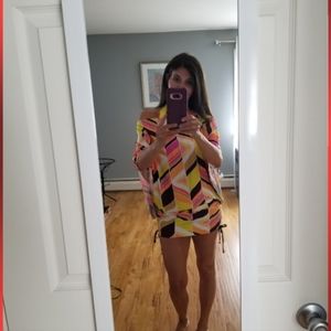 Size small Scrunch side with pull strings on sides swim cover up.